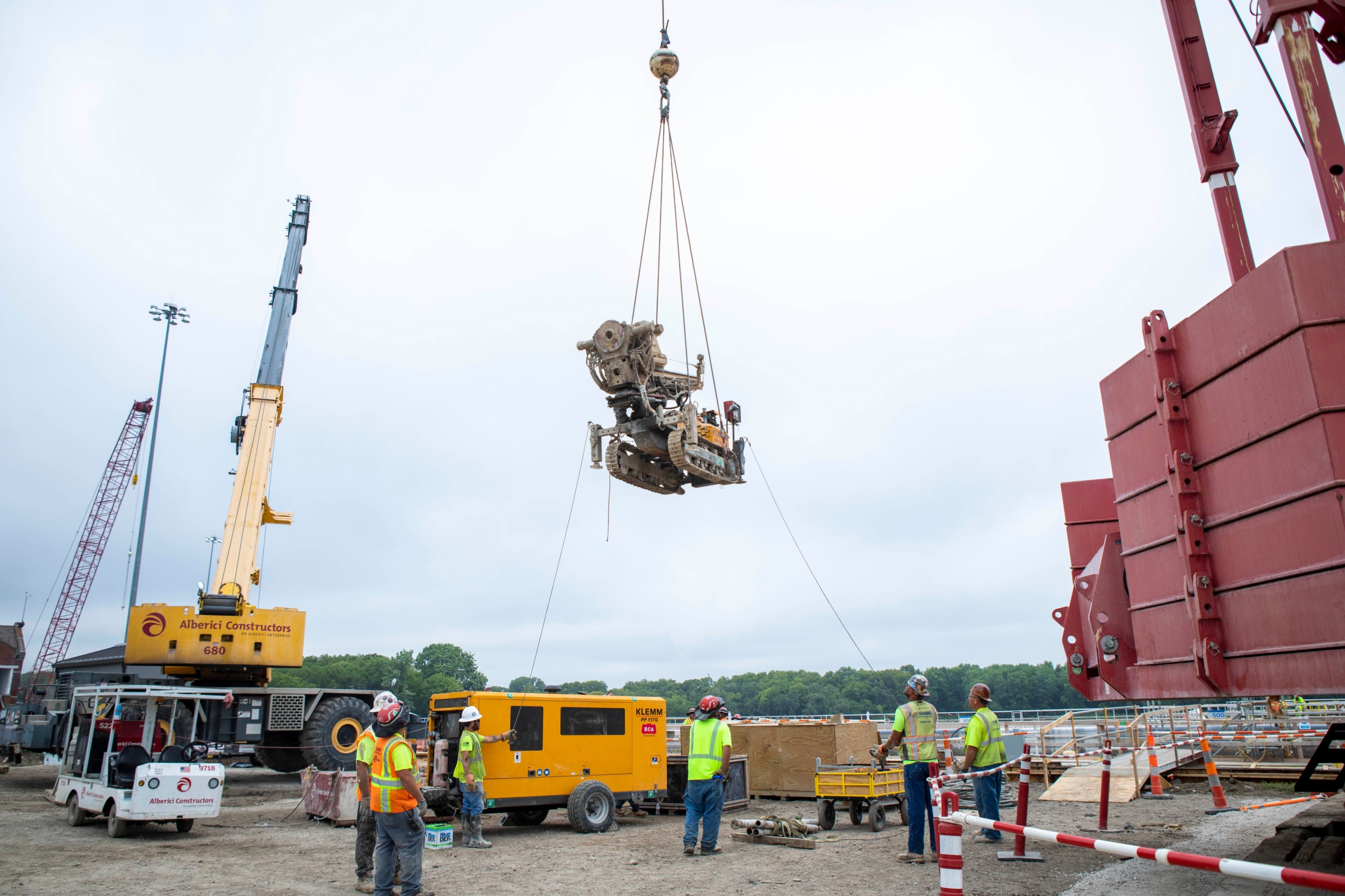 Klemm 702 drill rig being flown over the Dresden Island Lock Permanent Concrete Anchor Rods