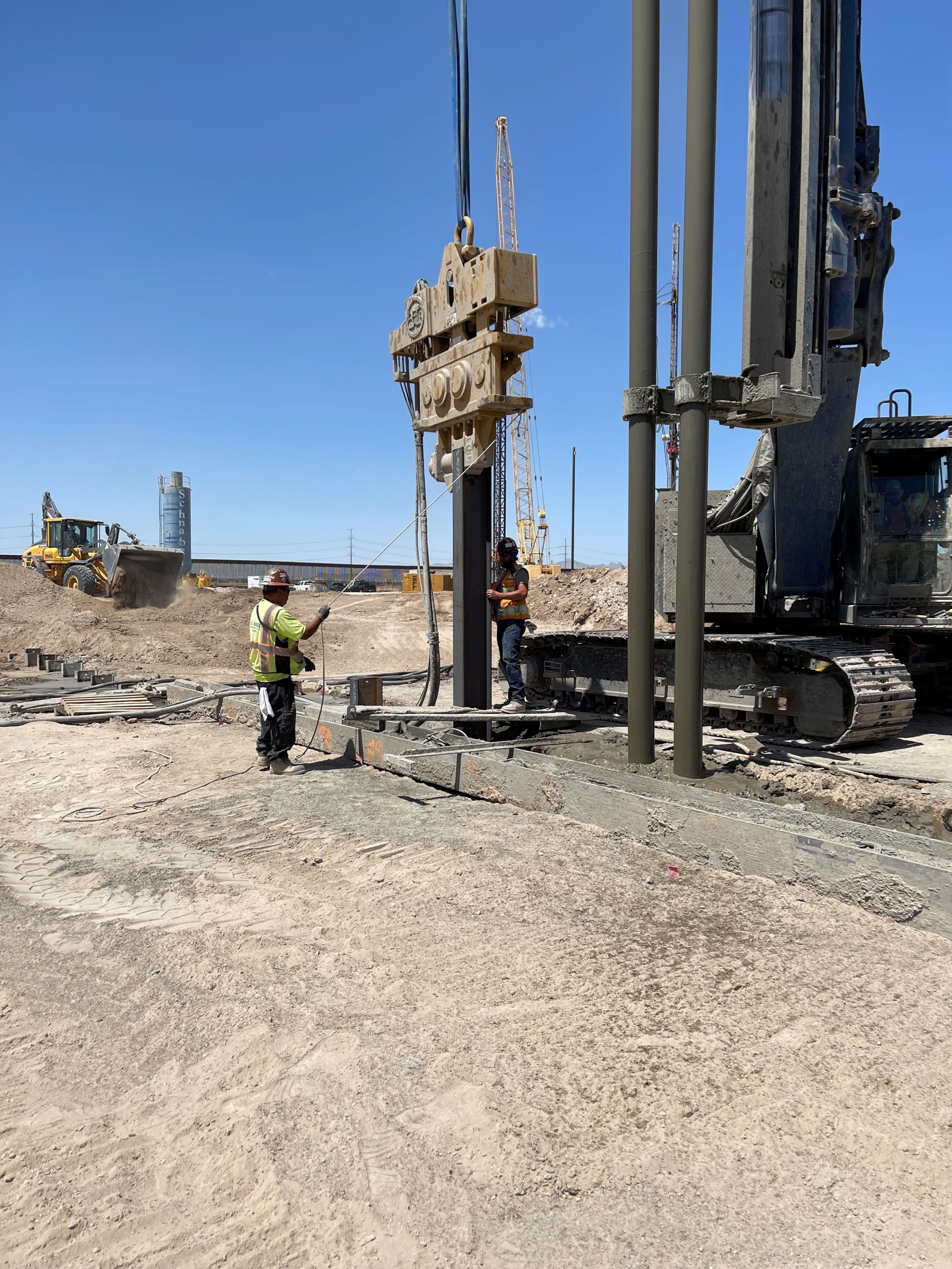 Vibrating in soldier piles and mixing soil mix panels Soldier Piles